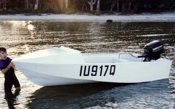 Small boat with Blake onboard